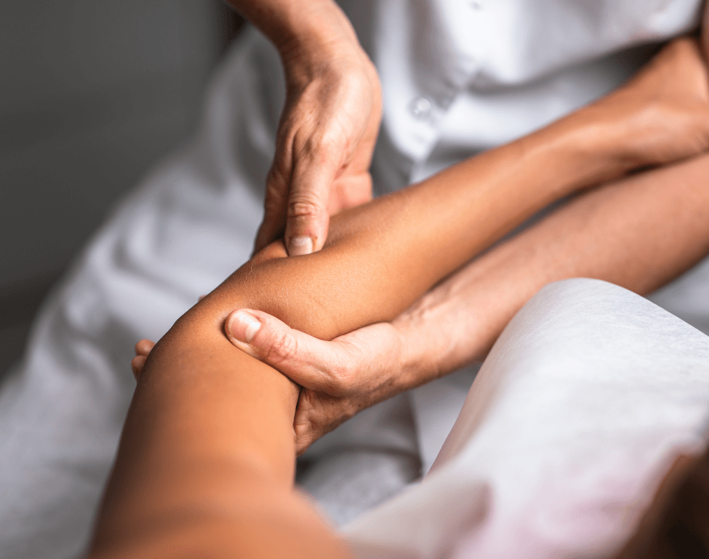 Close-up of a deep tissue leg massage being performed by a therapist, focusing on muscle release and tension relief