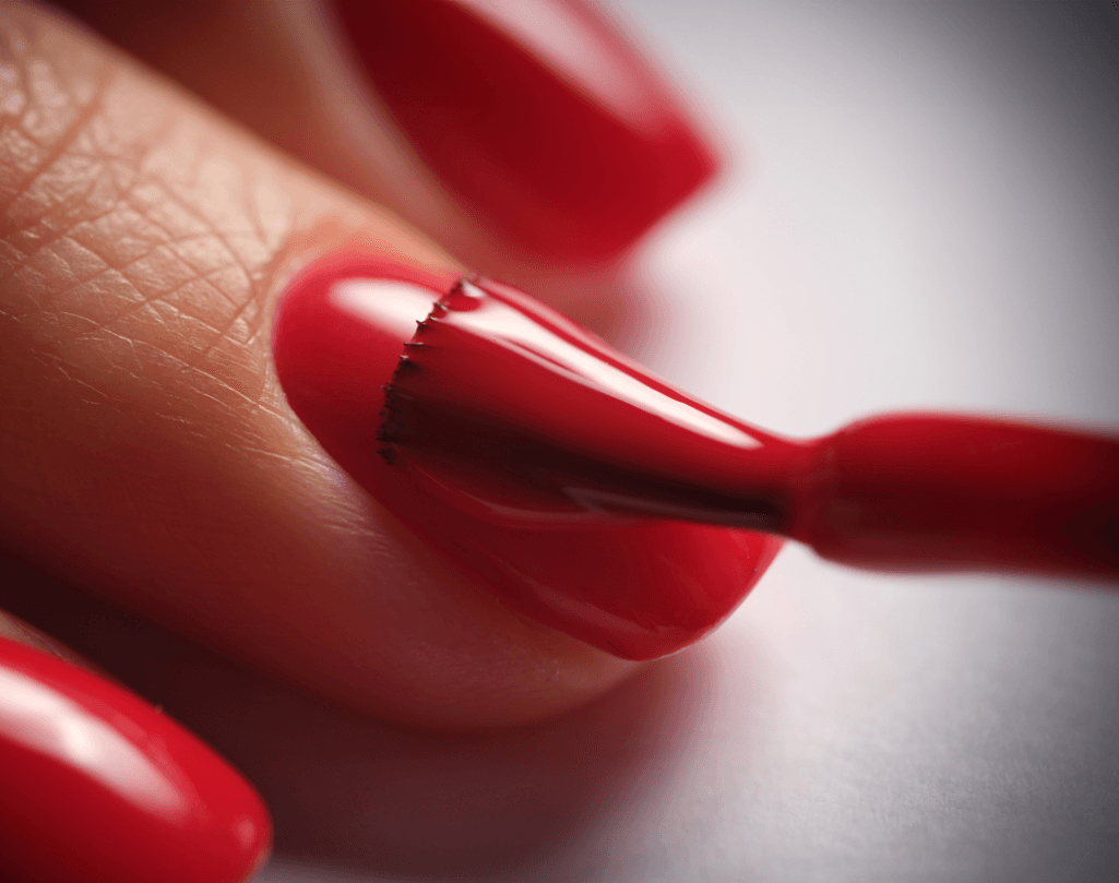 Close-up of red nail polish being applied during a re-paint service at The Beauty Spot in Wadebridge