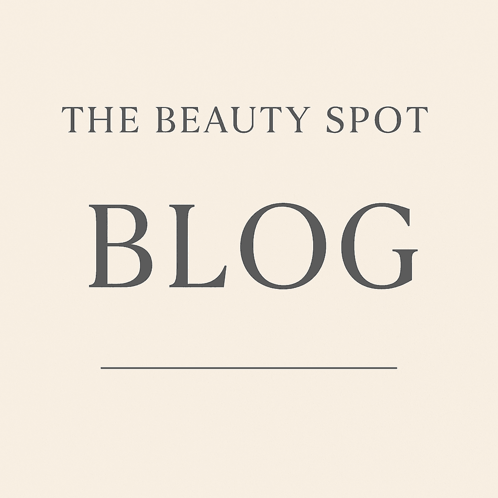 Minimalist blog header image with "The Beauty Spot BLOG" written in elegant dark grey text on a soft beige background, designed for use on the salon’s blog page.